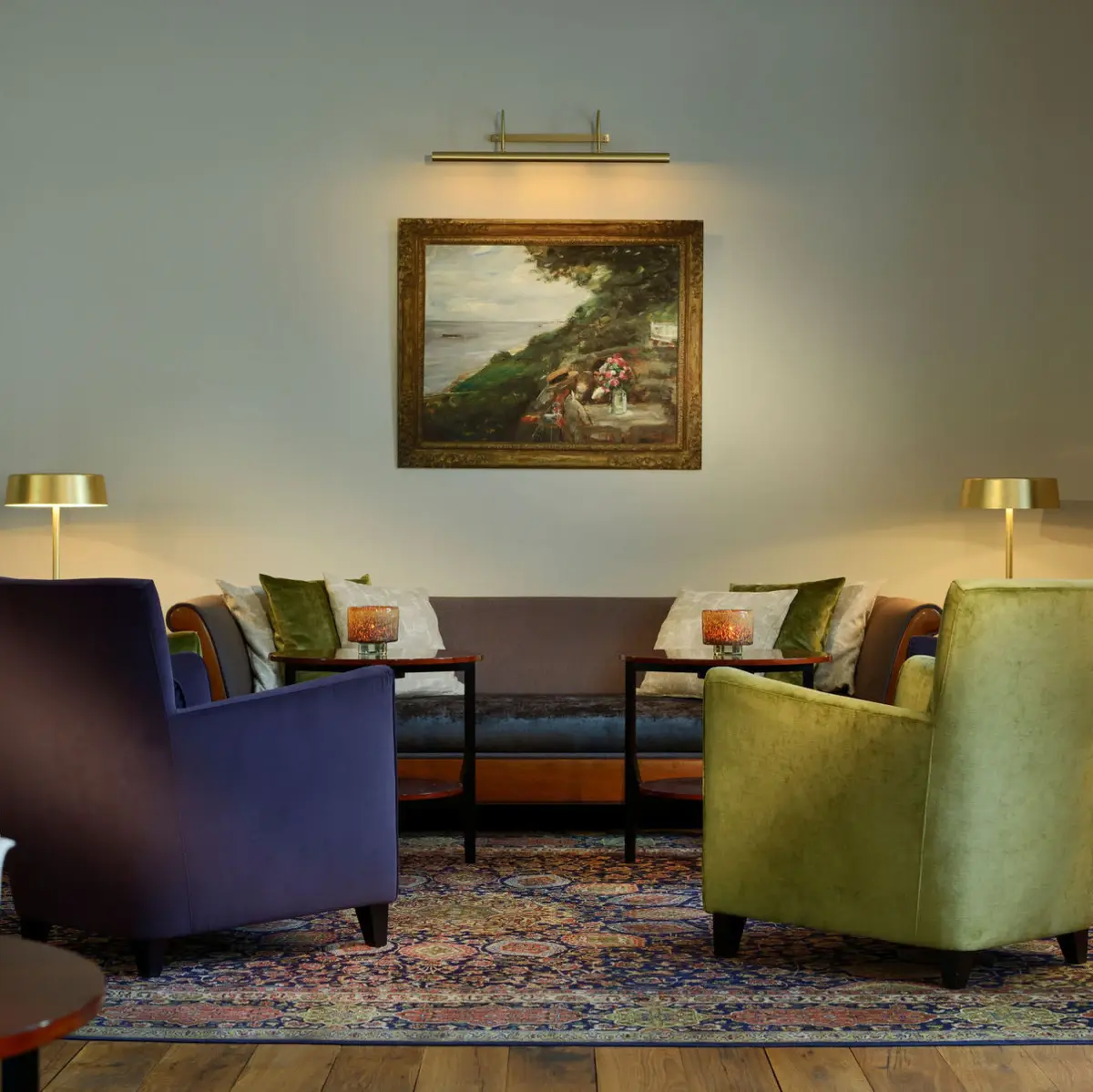 Louis C. Jacob Hotel Hamburg. A room with a couch, chairs, and a coffee table.